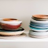 lifestyle image of colorful stacks of plates